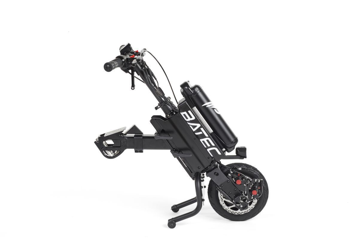 Black and silver Batec handbike, electric mobility device, with a front wheel, battery, and handlebars.