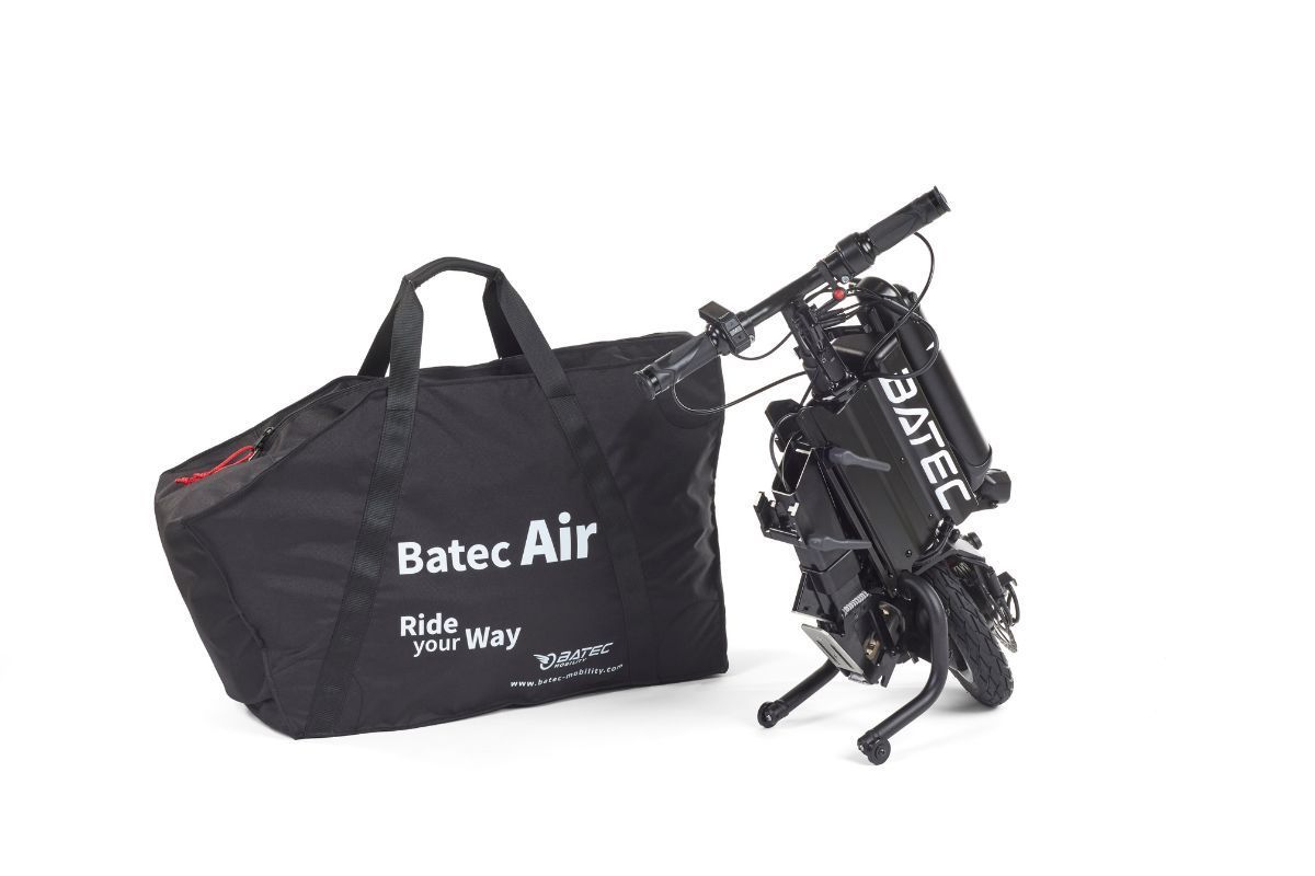 Black folded Batec Air handbike with a carrying bag on a white background.