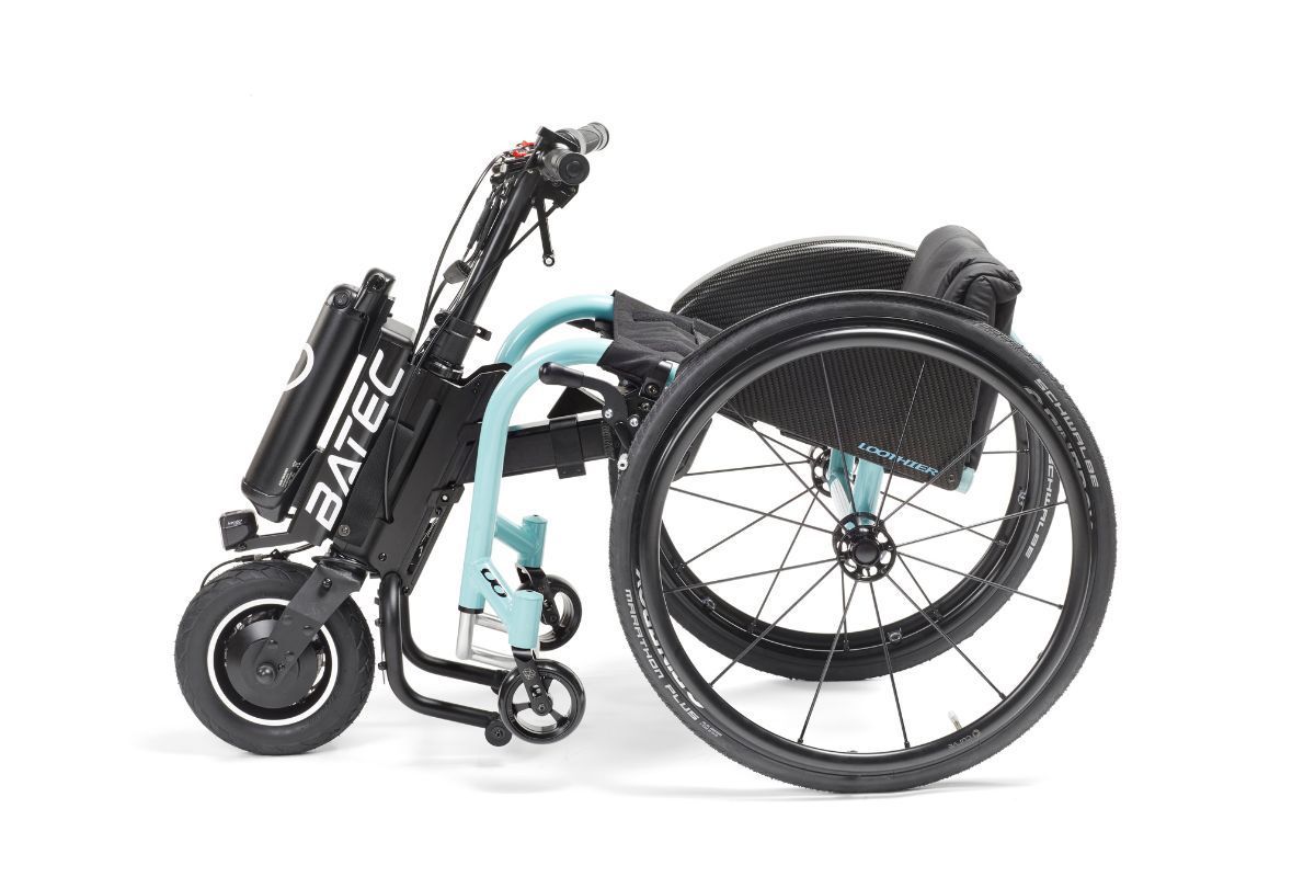 Black and teal electric wheelchair with attached motor and battery pack.