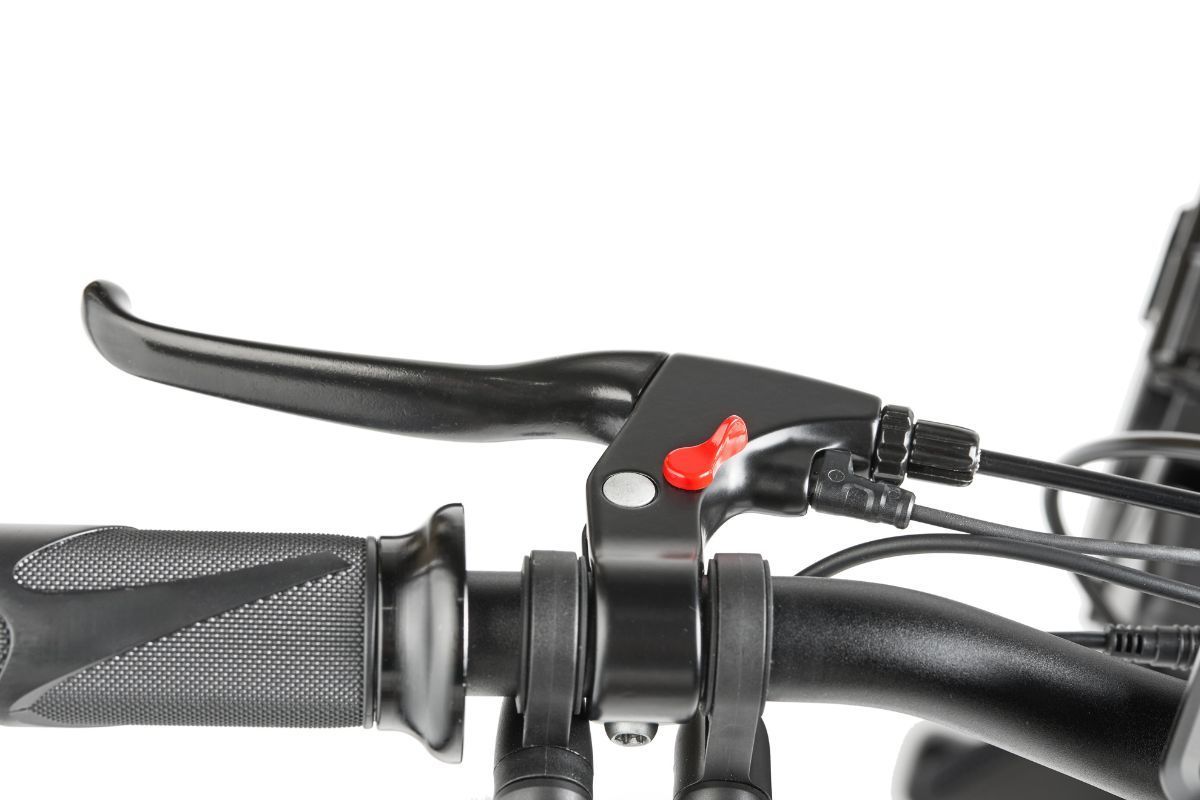 Black bicycle brake lever with red button on black handlebar.