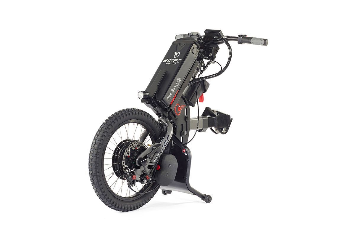 Black electric wheelchair with large off-road tire. Gray frame, controls on handlebar.