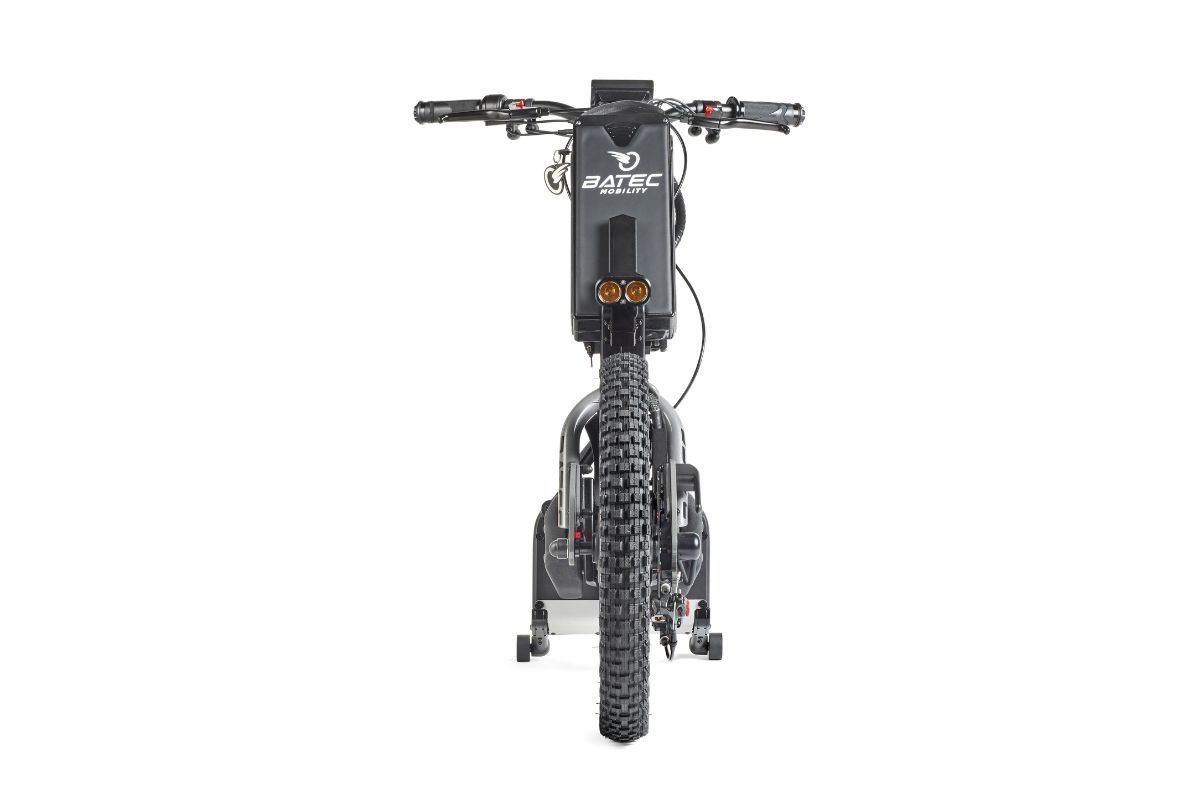 Black electric scooter, front view, thick tires, handlebars with controls, battery pack.