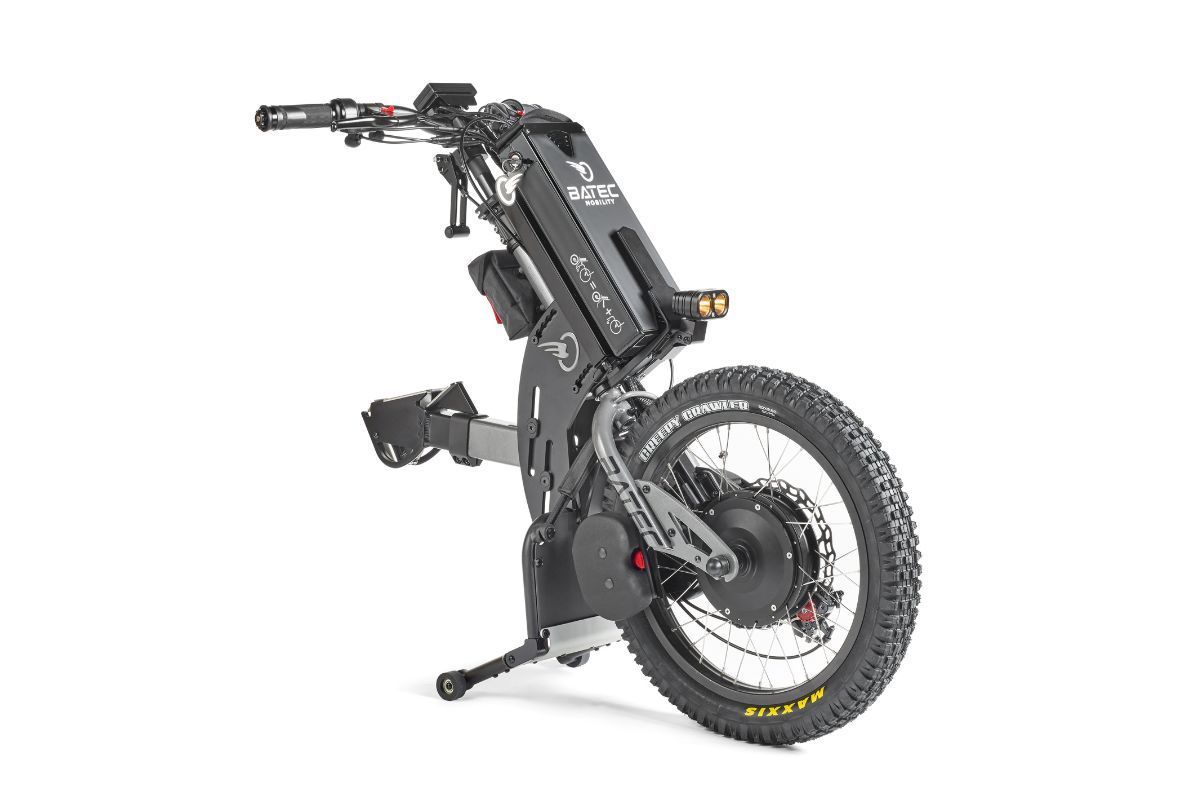 Black and gray all-terrain electric wheelchair with a large rear wheel, against a white background.