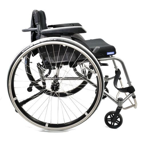 Silver wheelchair with black seat and back, angled on white background.