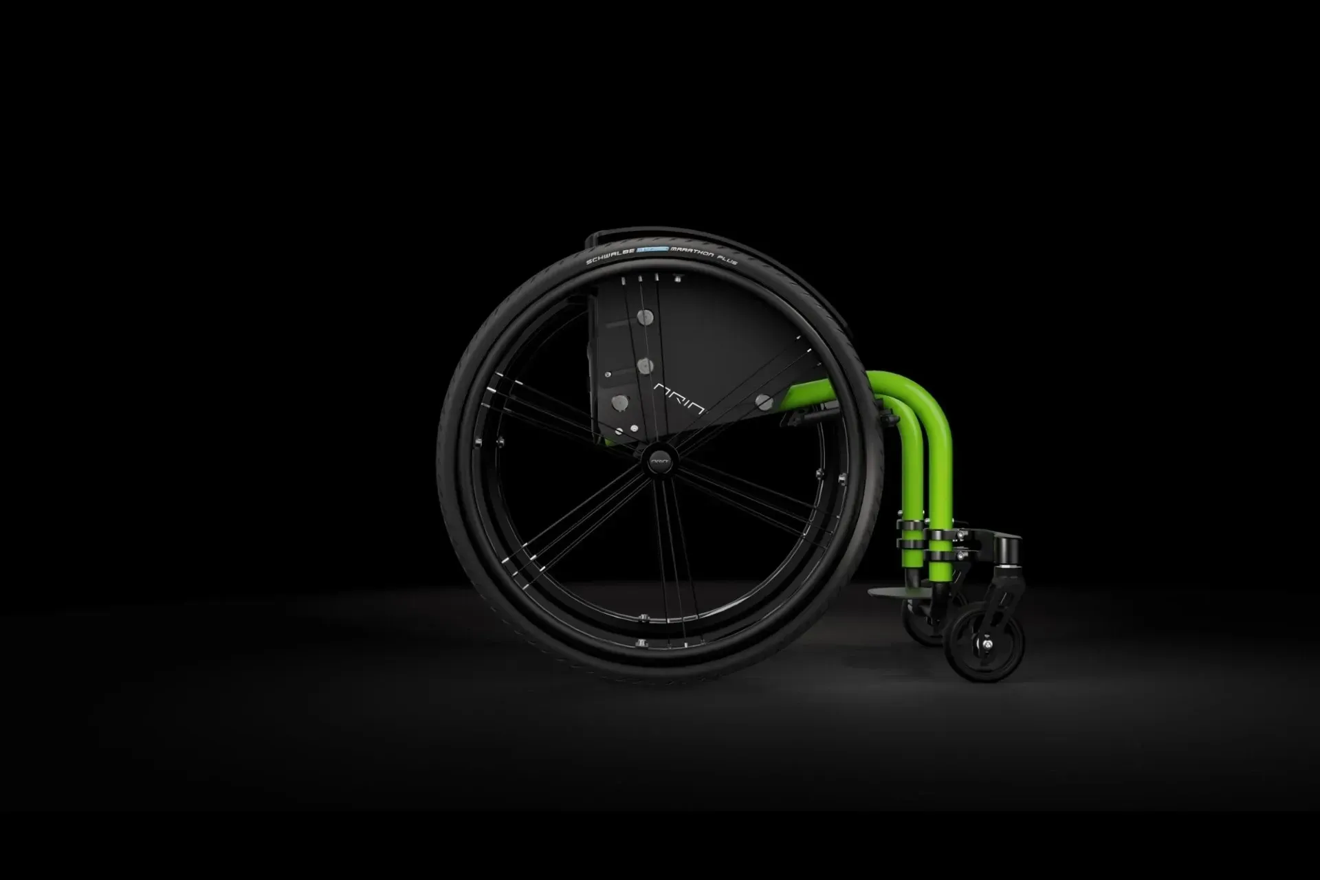Black and green wheelchair on a black background.