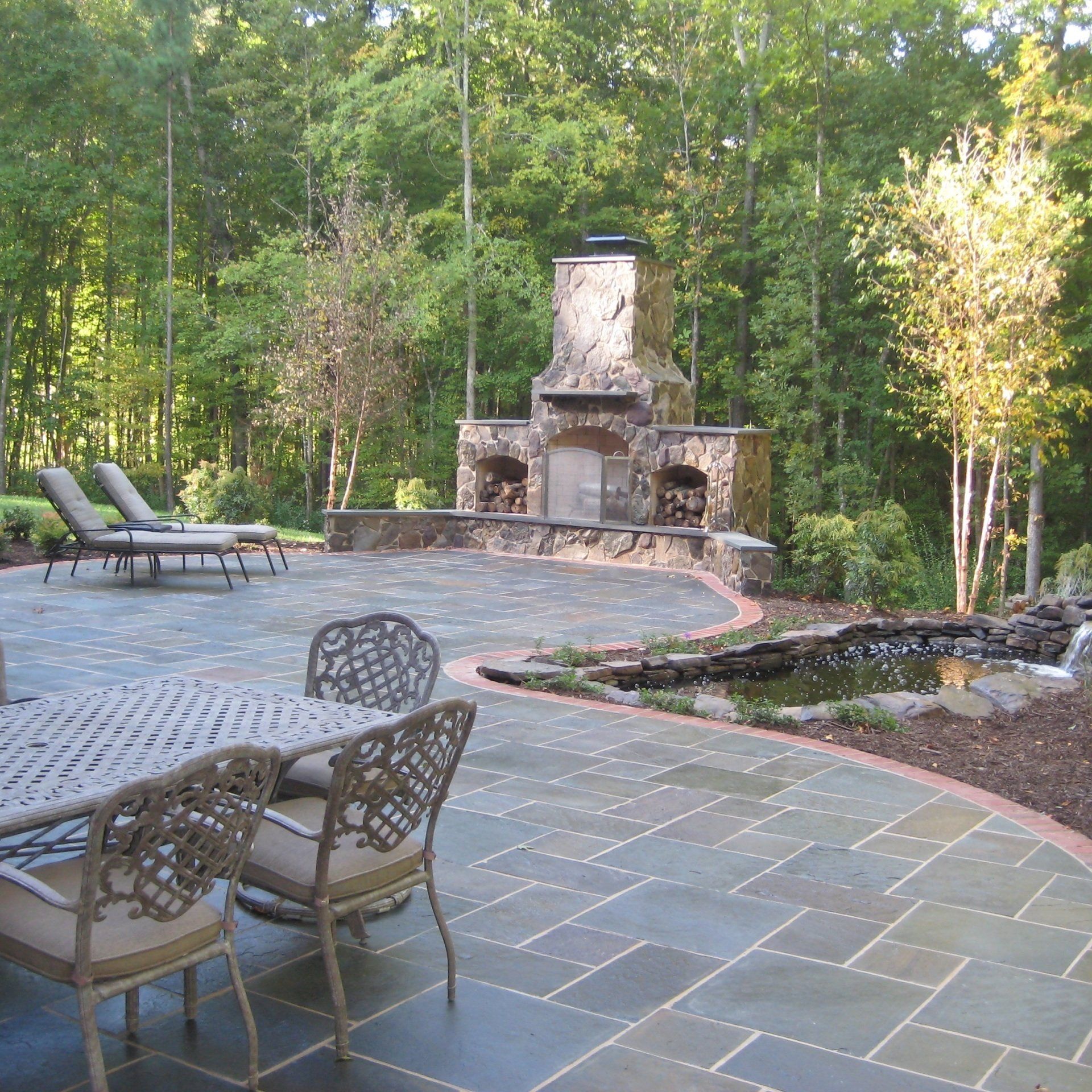 Patios — Exterior View of Villa with Patio with Wooden Flooring, Furniture and Steps in Richmond, VA