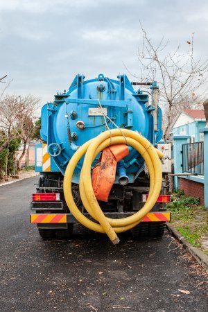 Septic Truck with Yellow Hose — Greenville, SC — American Waste Septic