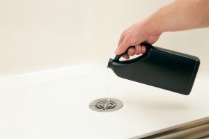 Man Hand Put Liquid in The Sink — Greenville, SC — American Waste Septic