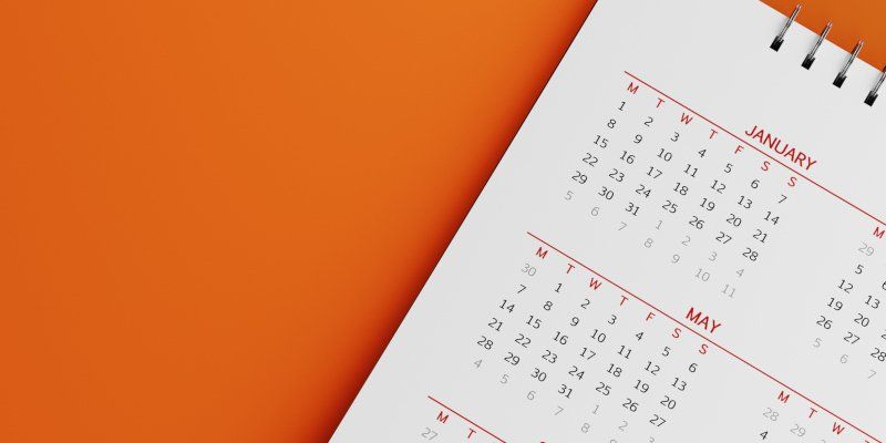 Calendar on Orange Background — Greenville, SC — American Waste Septic