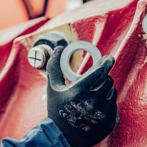 Two washers are stacked on top of each other on a white background