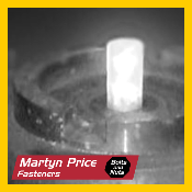A black and white photo of a bottle of martin price fasteners