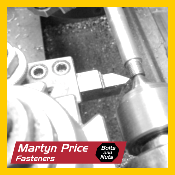 A black and white photo of a machine that says martyn price fasteners