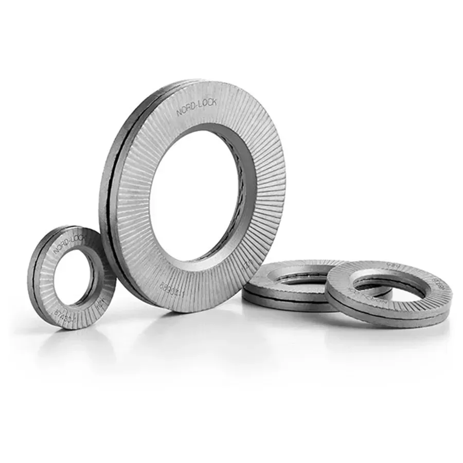 A group of washers are sitting on top of each other on a white surface.