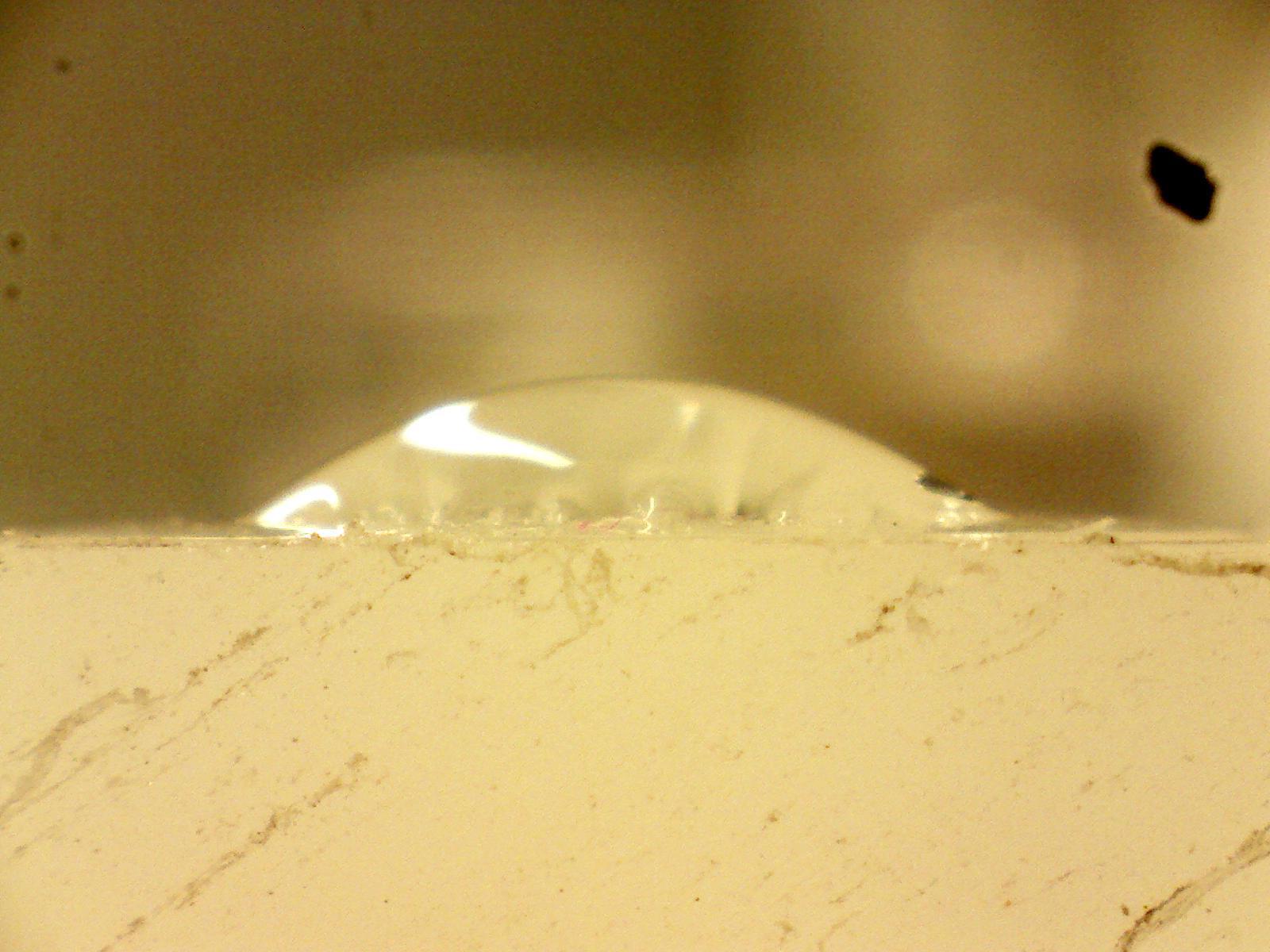 A close up of a piece of plastic on a wall