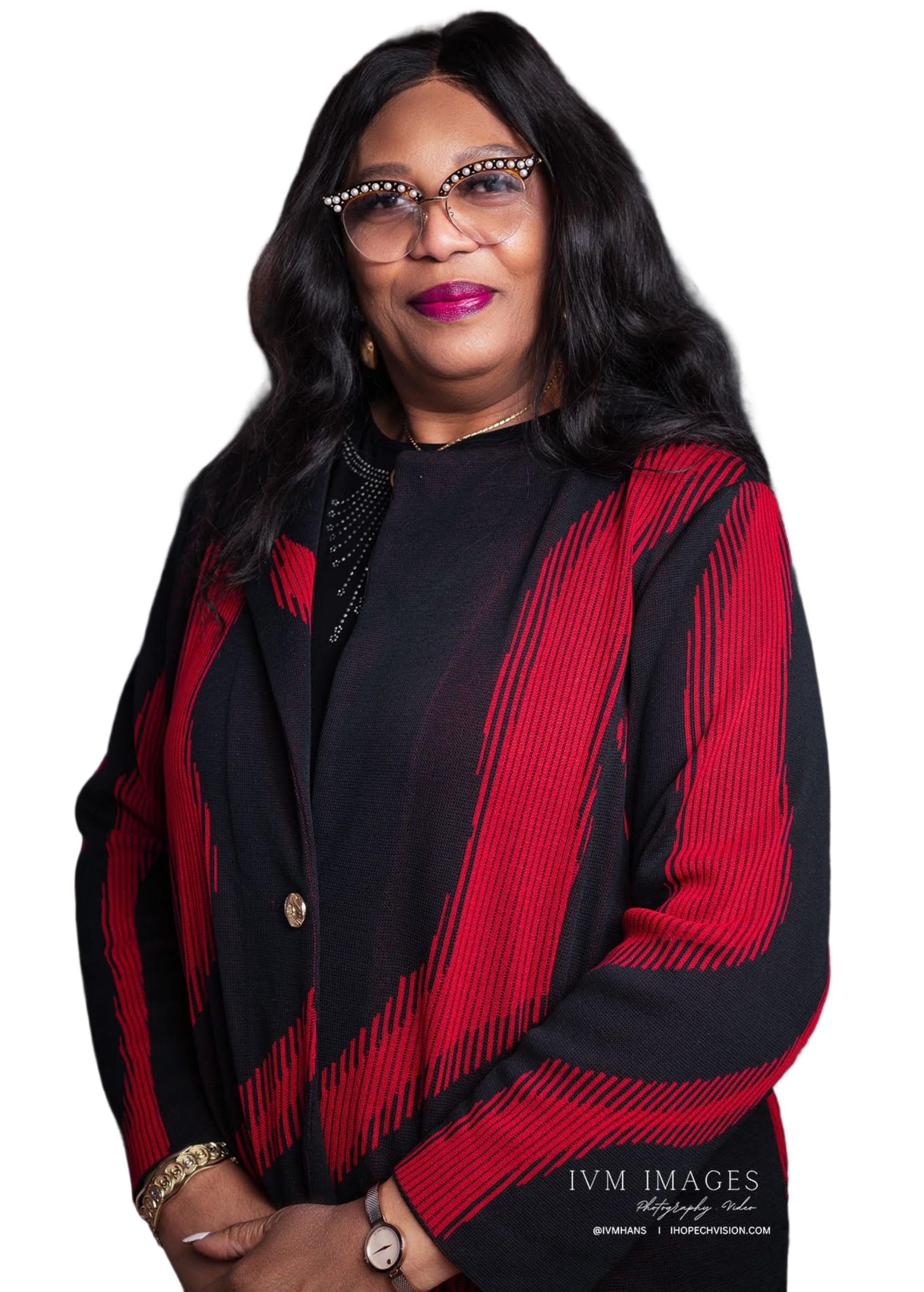 A woman wearing glasses and a red and black jacket