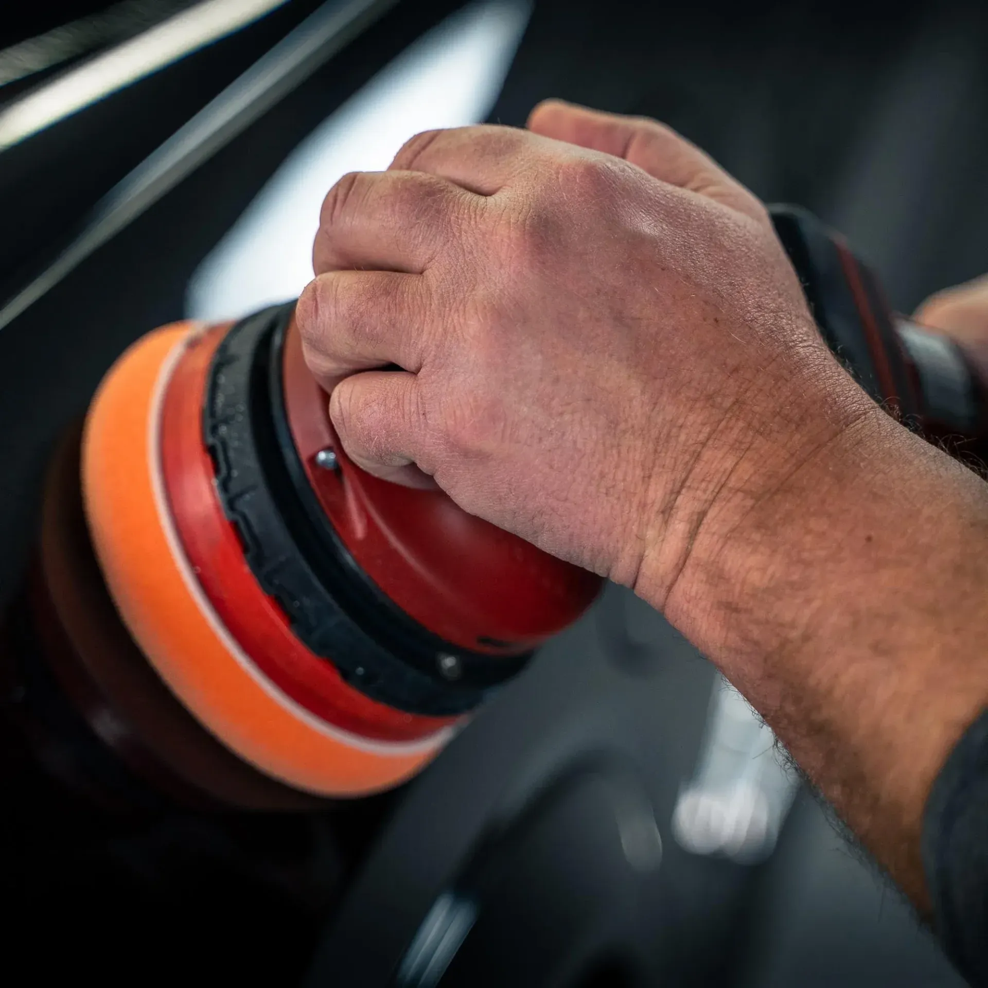 A wooden fence is sitting on top of a lush green field.