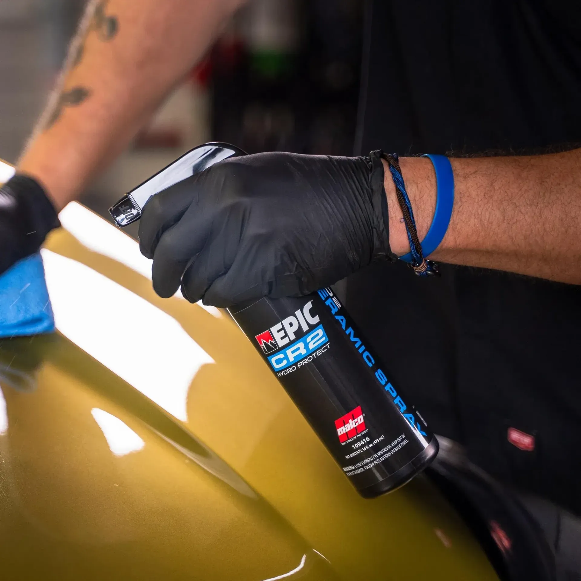 A wooden fence is sitting on top of a lush green field.
