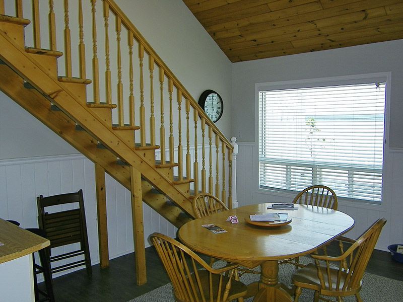 A wooden staircase leading up to the second floor of a house