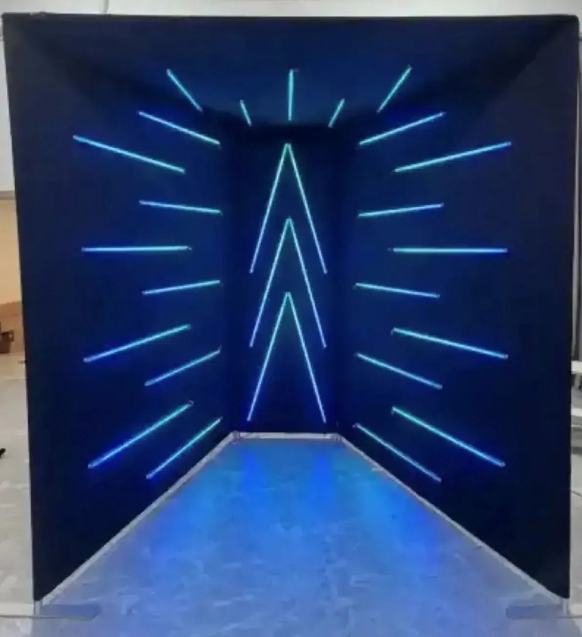 A dark room with blue lights on the walls