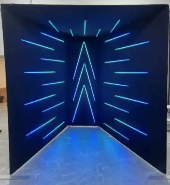A dark room with blue lights on the walls