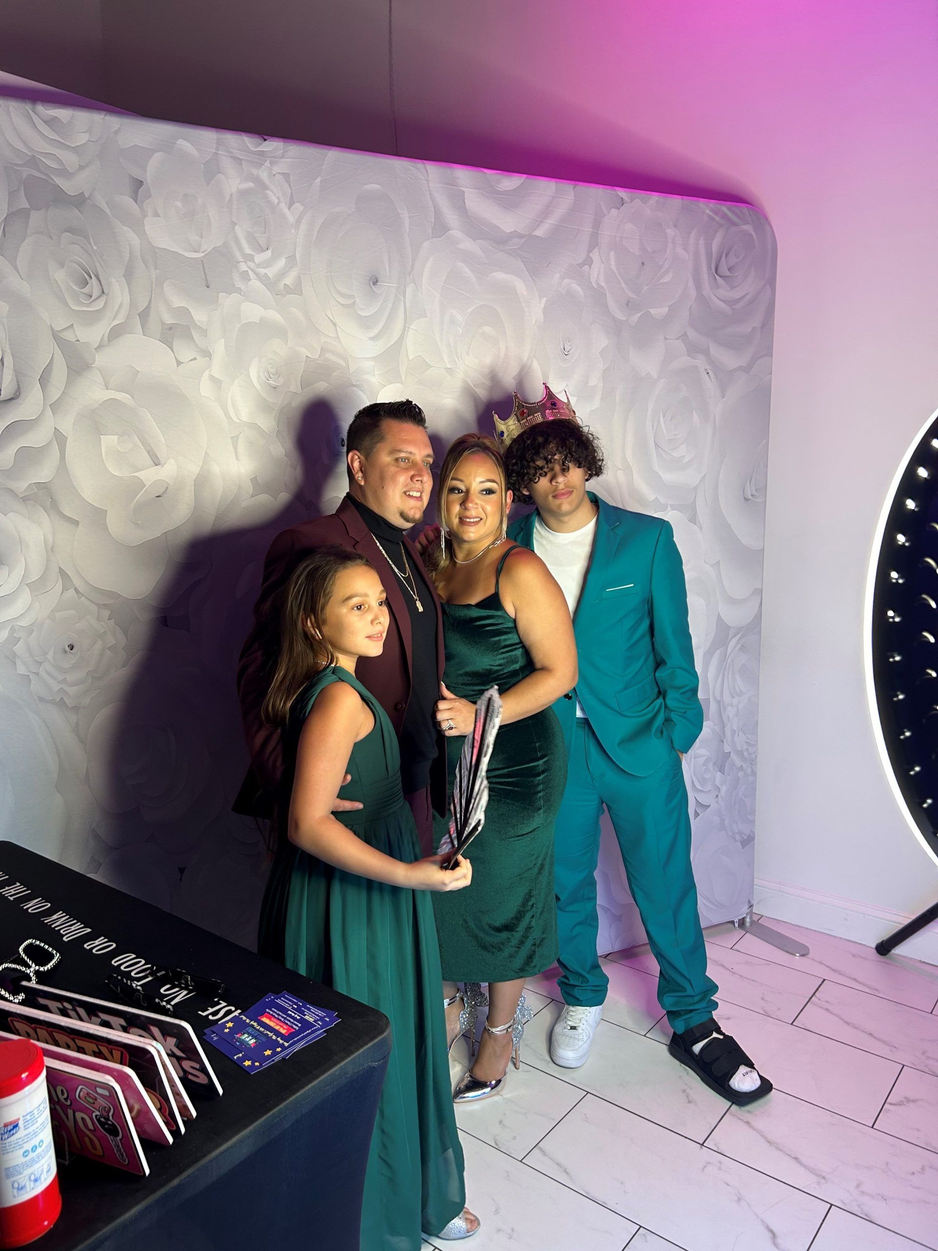 A family is posing for a picture in a photo booth.