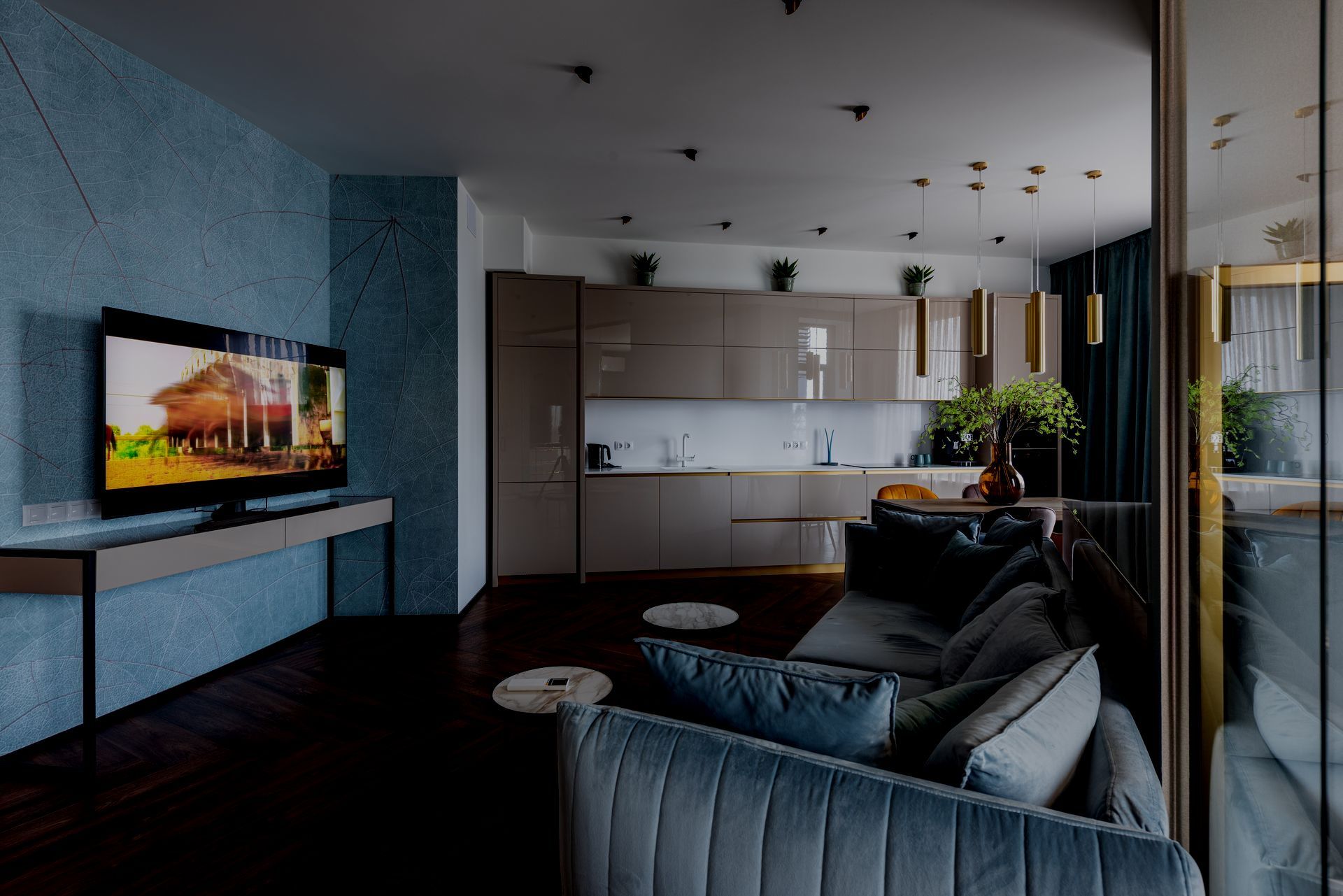 A living room with a couch and a flat screen tv.
