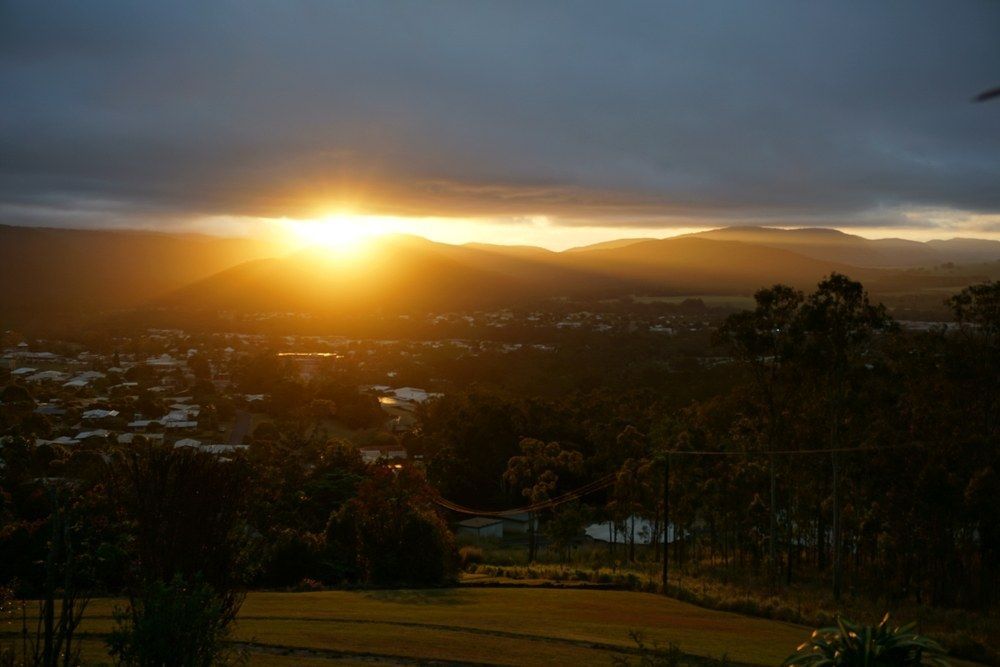Golden Sunrise Over A Town Nestled In A Valley — All Grind & Coat in Atherton, QLD