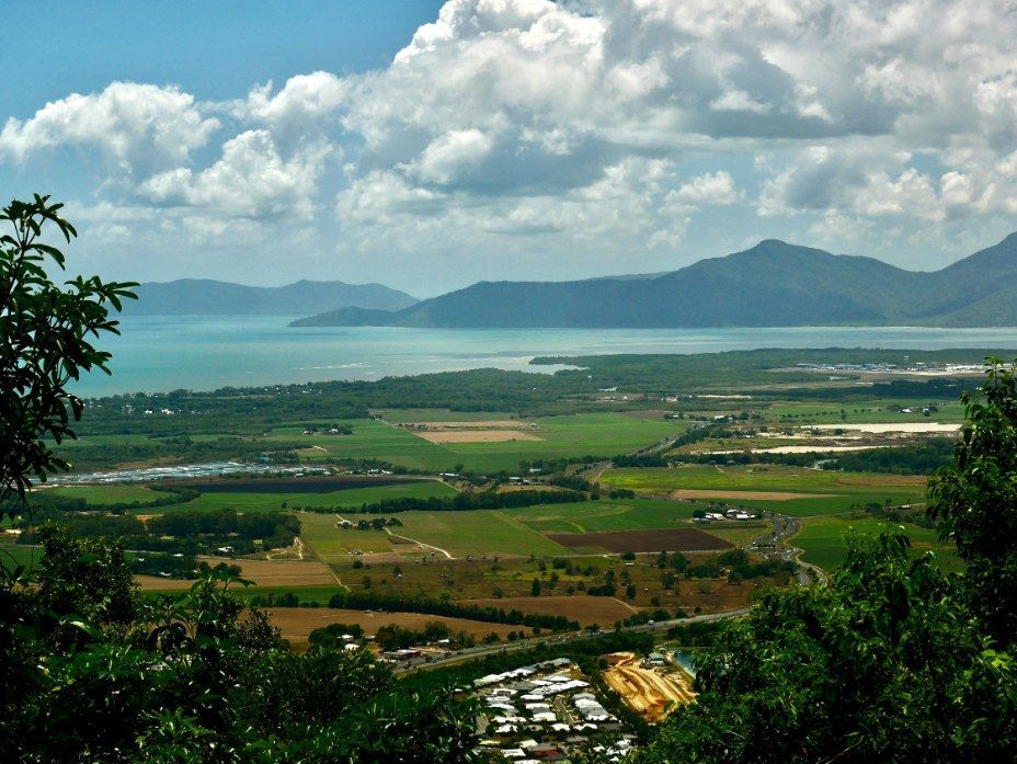 Green Landscape Overlooking A Bay With Mountains — All Grind & Coat in Atherton, QLD