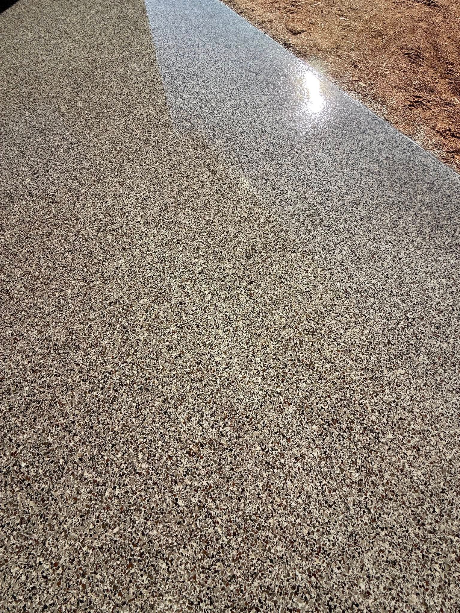 A Concrete Floor Being Smoothed With A Power Trowel; Outdoor, Daylight — All Grind & Coat in Cairns, QLD