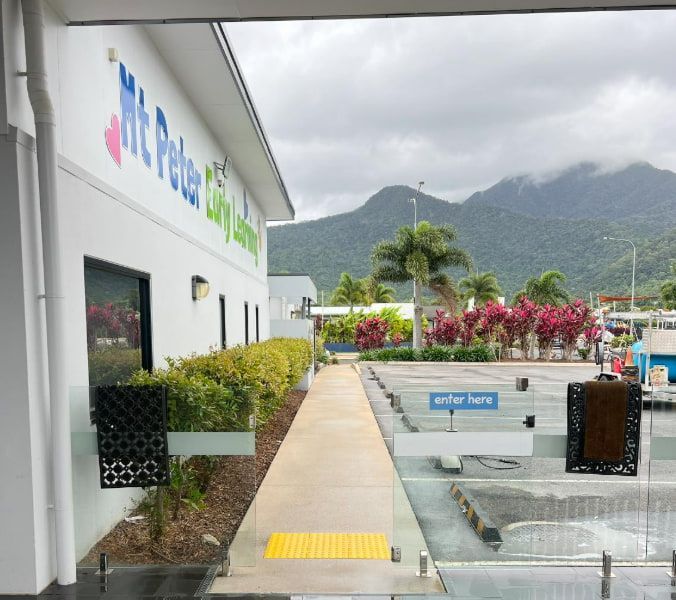 A White Building With The Word Peter On It — All Grind & Coat in Cairns, QLD