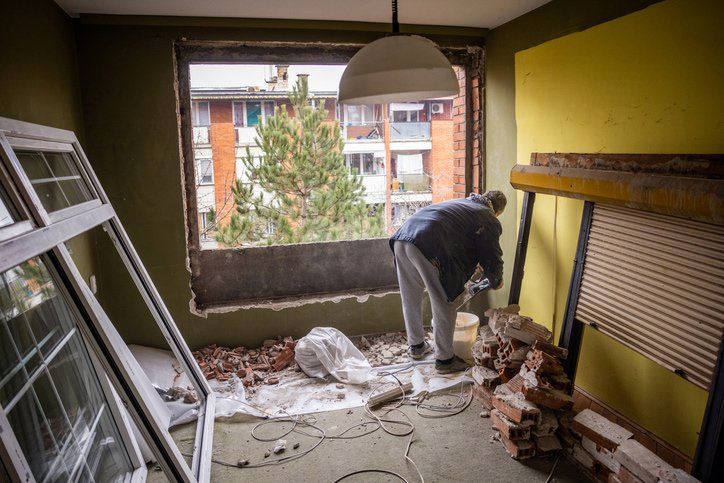 Man demolishing wall to install window | Sydney, NSW | M & M Demolition Pty Ltd