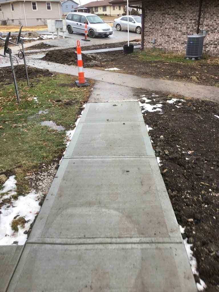 Simple Sidewalk — Skid Loader in Lincoln, MO