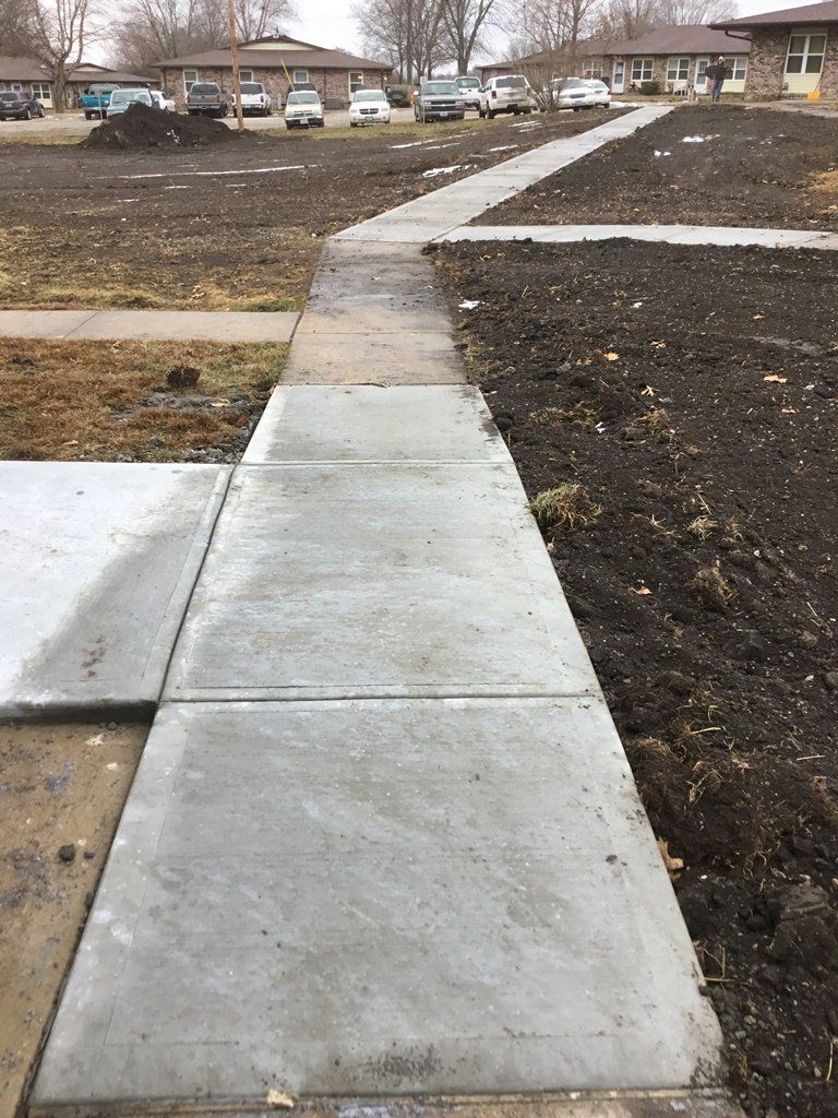 Home Sidewalk — Skid Loader in Lincoln, MO