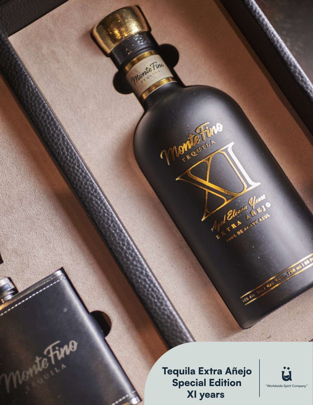 Black tequila bottle with gold accents and flask in a presentation box.