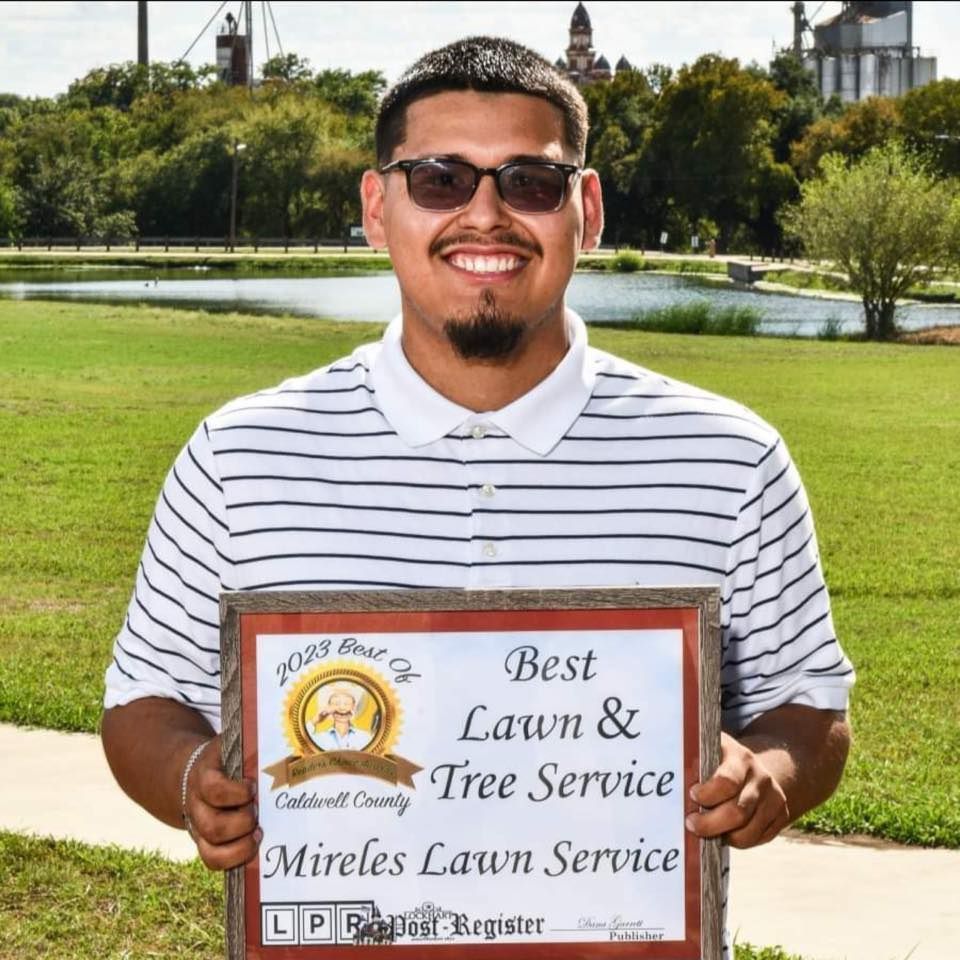 Man in sunglasses holding 