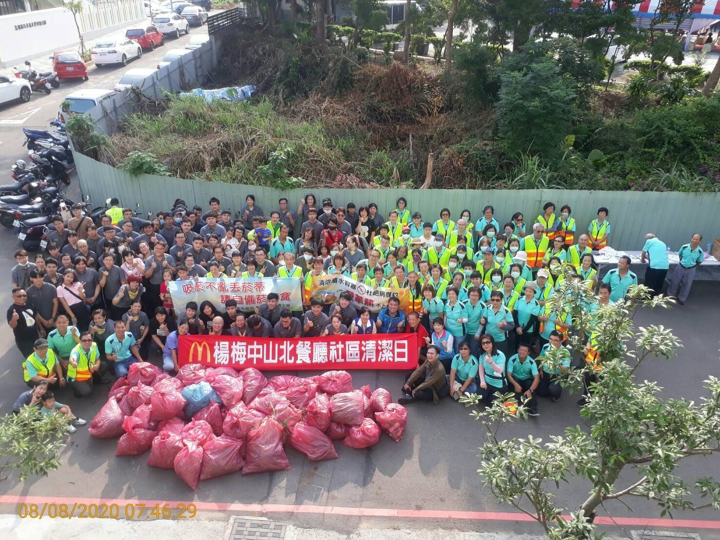 A group of people are posing for a picture under a tent.