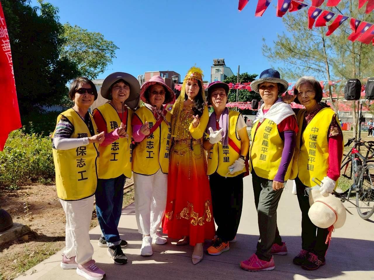 A woman is holding a red sign with chinese writing on it