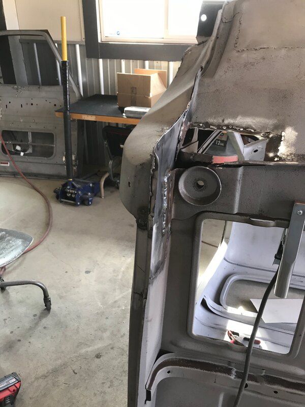 A machine is being worked on in a garage.