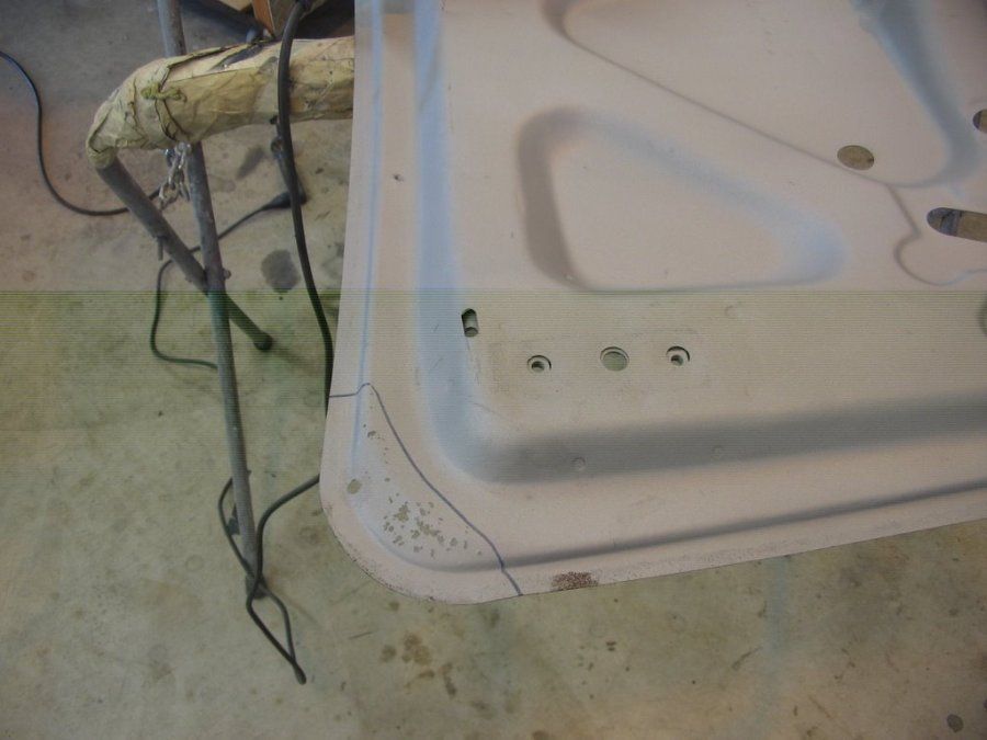 A piece of metal is sitting on the floor next to a chair