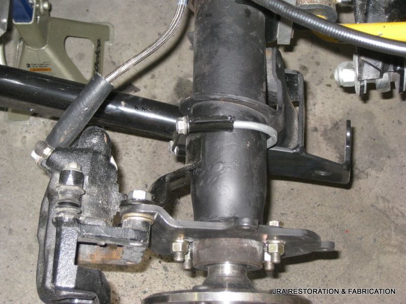 A close up of a steering wheel with a hose attached to it