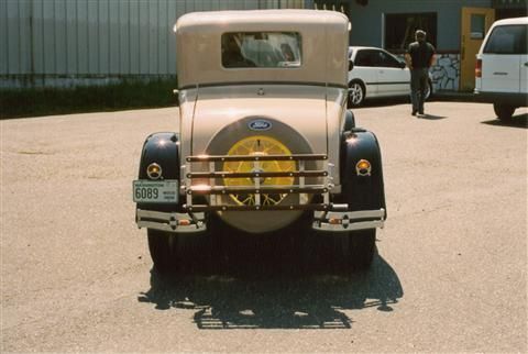 A ford car is parked in a parking lot