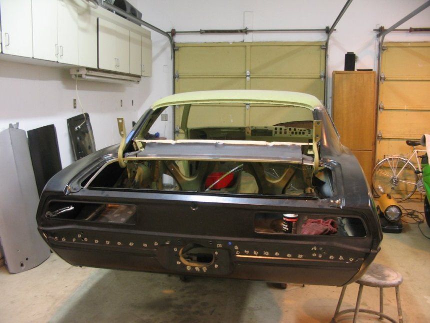 A car that is being built in a garage