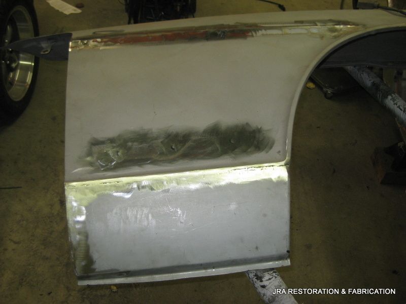 A white car door is being repaired by usa restoration & fabrication