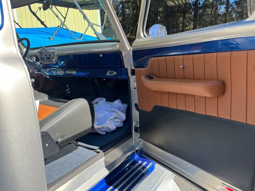 A close up of the inside of a car with the door open.