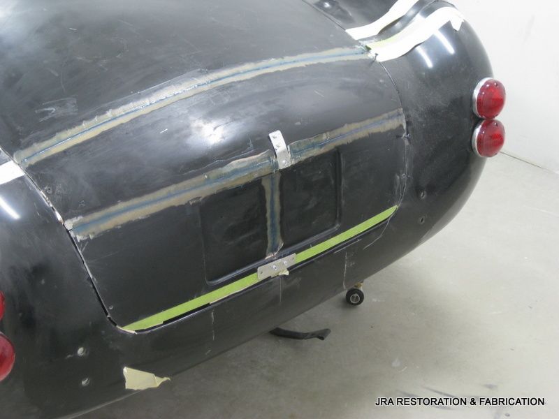 A black car is being restored by usa restoration & fabrication