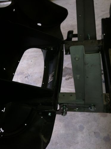 A black object is sitting on a concrete floor