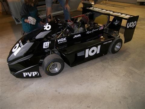 A black race car with the number 101 on it