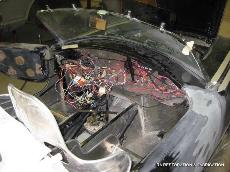 A car with a lot of wires coming out of it