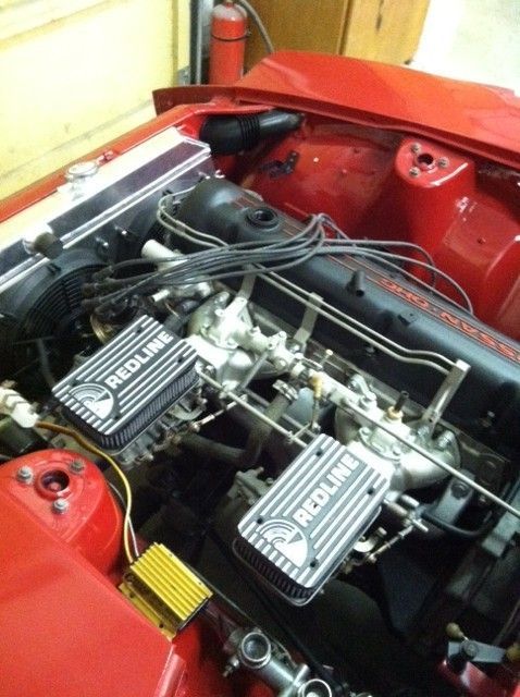 A red car with a redline engine