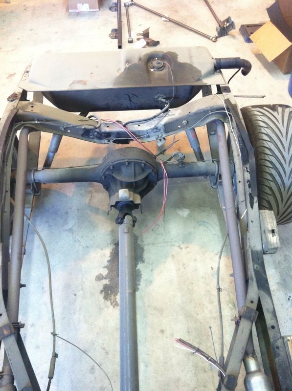 A car frame with a fuel tank on top of it